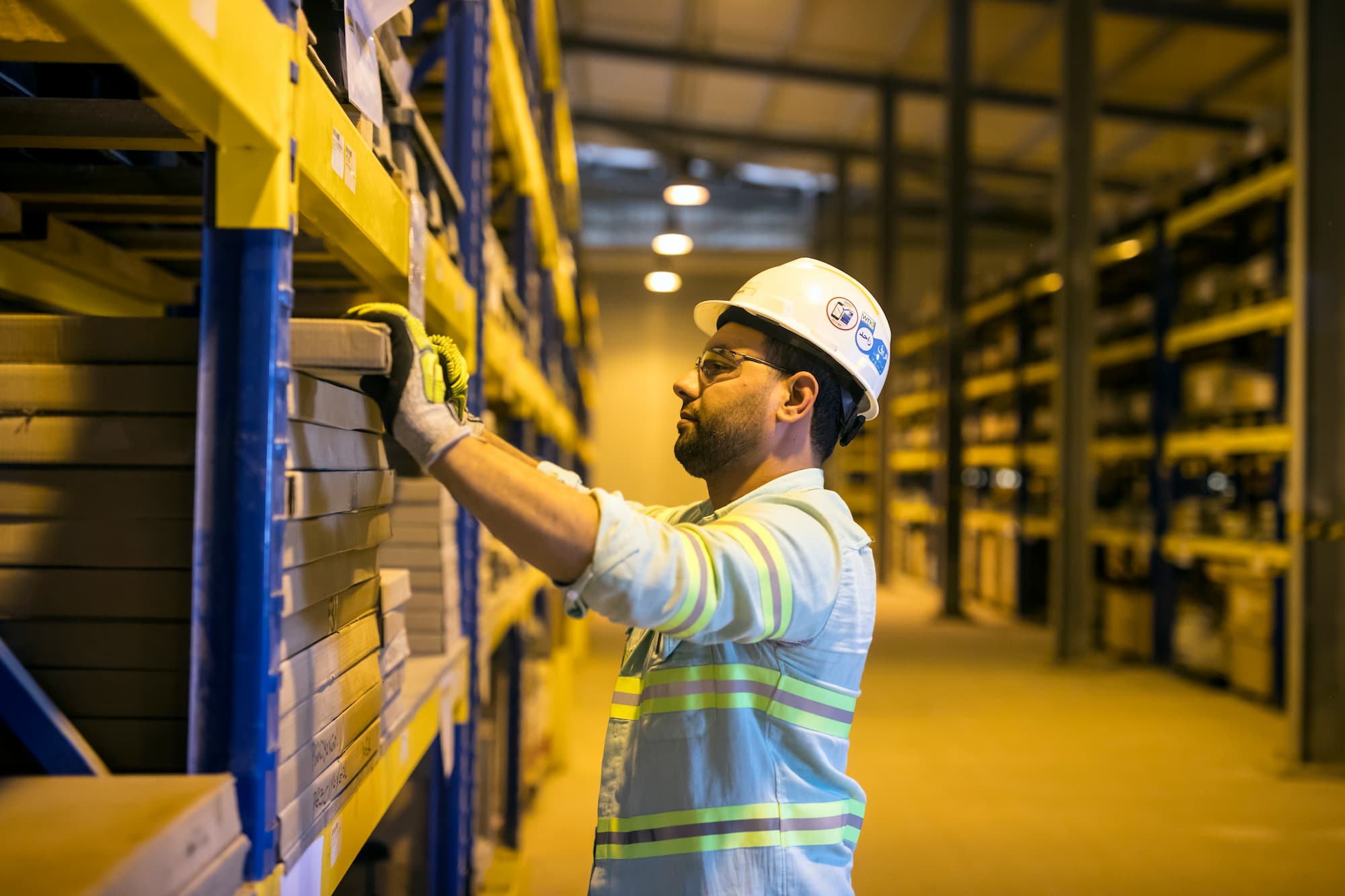 Craft professional checks materials stocks in warehouse at West Nile Delta Gas Terminal job site.