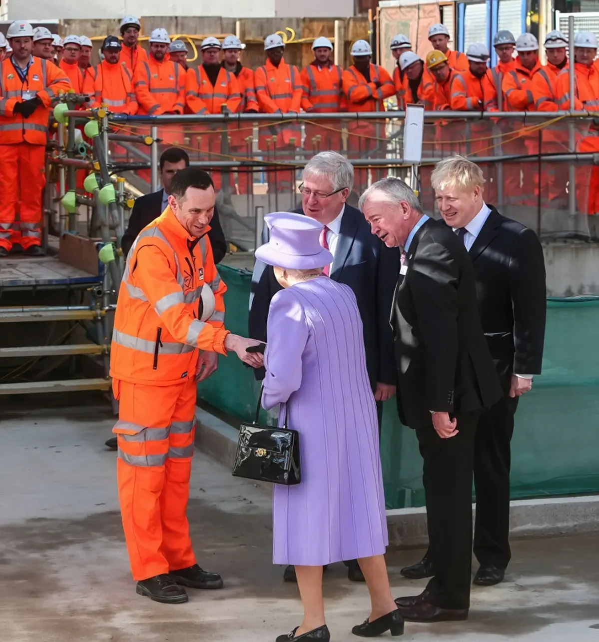 HM Queen Elizabeth II meet with construction workers including a Bechtel project manager