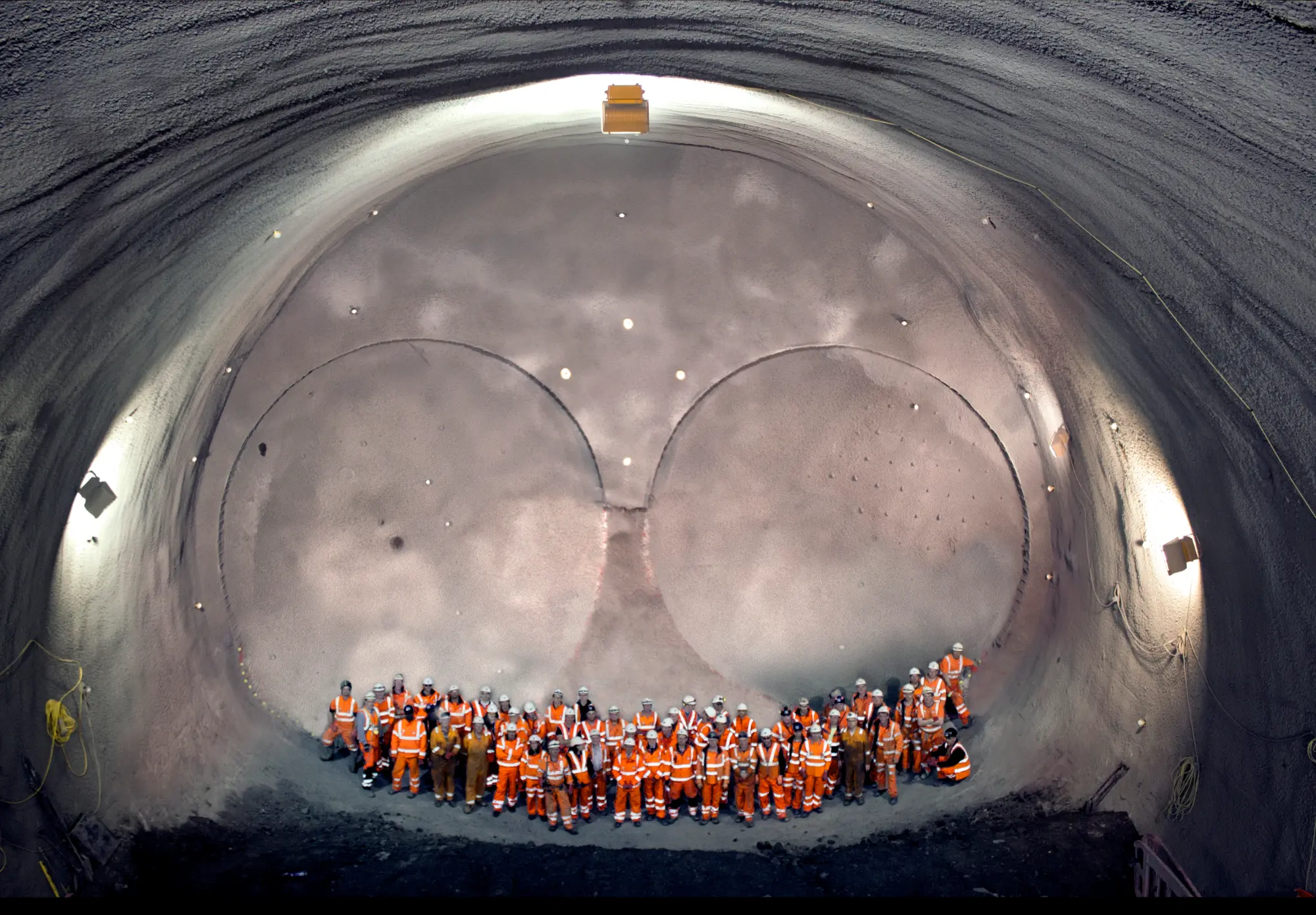 Group photo of workers in the tunnels.