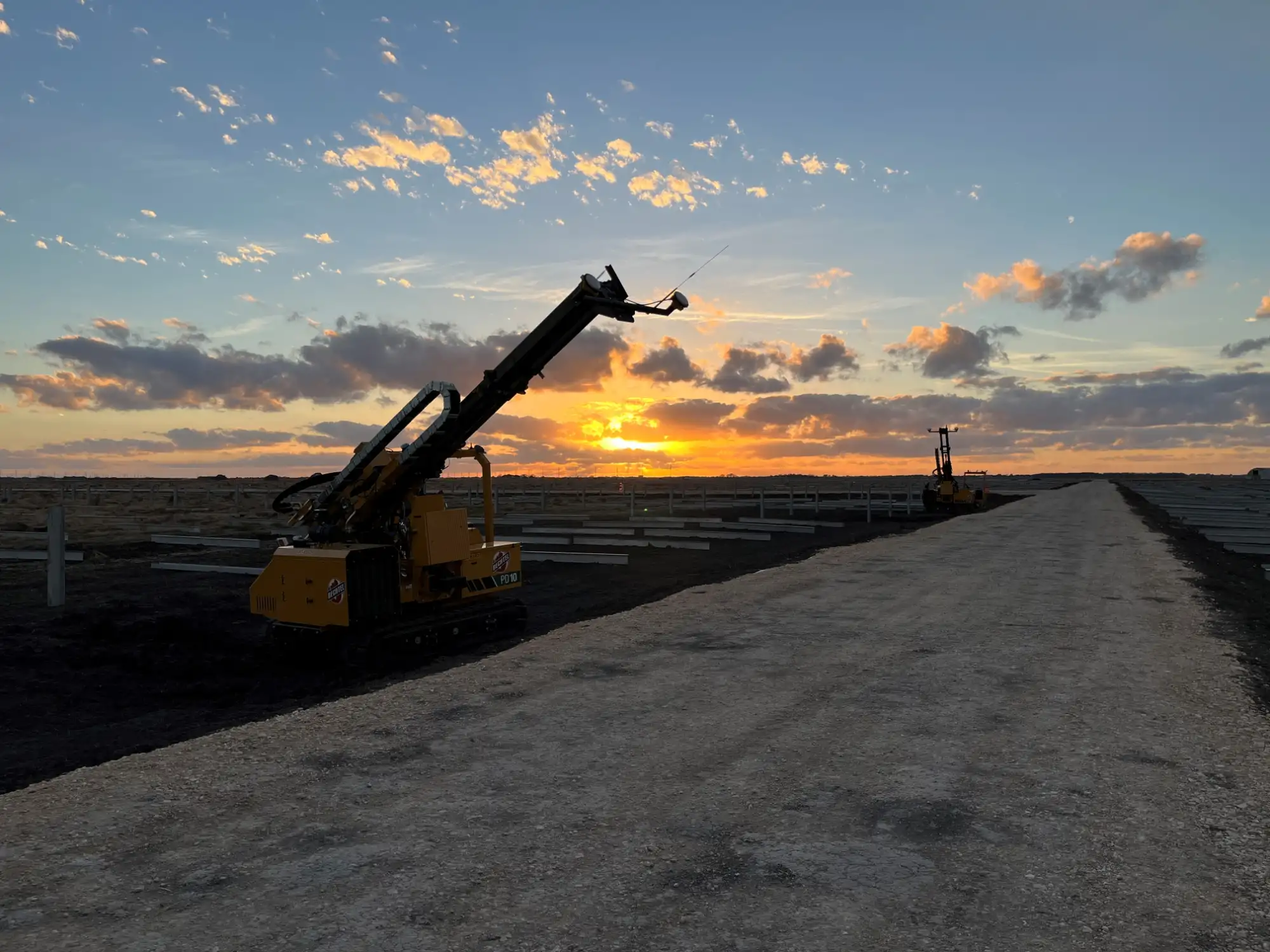 Sunset view of solar project with project equipment.