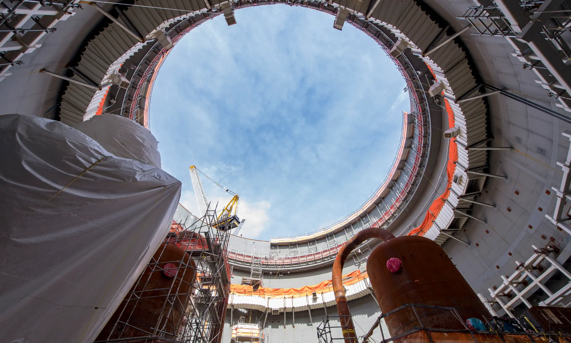 Aerial view of the sky looking out of the Unit 3 containment vessel, including a look at the steam generators inside of the vessel.